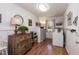 Functional laundry room with wainscoting, built-in storage, and natural light provides a practical and organized space at 449 Hill Rd, Franklinton, NC 27525