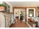 Open-concept living room showcasing hardwood floors and beautiful wood beam architecture, providing a bright and airy atmosphere at 449 Hill Rd, Franklinton, NC 27525
