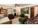 A cozy living room with comfortable seating, a decorative fireplace, and a vintage TV at 449 Hill Rd, Franklinton, NC 27525