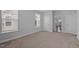 Comfortable bedroom with carpet and three windows, offering a relaxing retreat at 450 Shale Creek Dr, Durham, NC 27703