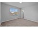 Neutral carpeted bedroom with one window and a closet door at 450 Shale Creek Dr, Durham, NC 27703