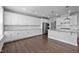 Bright open kitchen featuring a spacious island, stainless appliances and white cabinetry at 450 Shale Creek Dr, Durham, NC 27703