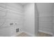 Ample shelving provides generous storage space in this simple, yet functional laundry room at 450 Shale Creek Dr, Durham, NC 27703