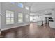 Open concept living room seamlessly connects to a modern kitchen with stainless steel appliances at 450 Shale Creek Dr, Durham, NC 27703