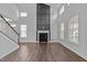 Spacious living room featuring a fireplace, soaring ceilings, and hardwood floors at 450 Shale Creek Dr, Durham, NC 27703
