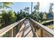 Outdoor wooden walkway surrounded by trees and nature at 450 Shale Creek Dr, Durham, NC 27703