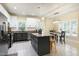 Well-lit kitchen featuring granite countertops, stainless steel appliances, and a stylish central island at 4793 Overhills Rd, Spring Lake, NC 28390