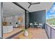 Balcony showcases a seating area and sliding glass door opening to a light-filled living space at 501 S Bloodworth St # 101, Raleigh, NC 27601