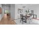 Dining area featuring modern furniture and decor, with views into the living space at 501 S Bloodworth St # 101, Raleigh, NC 27601