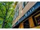 Upward view of a commercial building with exposed brick and vintage signage at 501 S Bloodworth St # 101, Raleigh, NC 27601