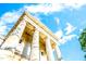Stately building exterior with prominent columns set against a bright blue sky at 501 S Bloodworth St # 101, Raleigh, NC 27601