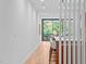 Hallway leading to the dining and living area with a modern design and natural light at 501 S Bloodworth St # 101, Raleigh, NC 27601