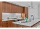 Stylish kitchen featuring custom cabinets, modern lighting, and a large island at 501 S Bloodworth St # 101, Raleigh, NC 27601