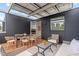 Beautiful, covered patio with a table and chairs as well as an outdoor seating area at 501 S Bloodworth St # 101, Raleigh, NC 27601