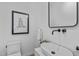 Modern bathroom with a floating sink, sleek fixtures, and minimalist decor at 501 S Bloodworth St # 104, Raleigh, NC 27601
