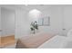 Bright bedroom with a skylight features neutral decor and a comfortable queen bed at 501 S Bloodworth St # 104, Raleigh, NC 27601