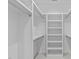 Organized walk-in closet with shelving, hanging rods, and ample storage space at 501 S Bloodworth St # 104, Raleigh, NC 27601