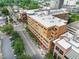This high-angle view shows the building's layout, nearby parking, tree lined streetscape, and location at 510 Glenwood Ave # 510, Raleigh, NC 27603
