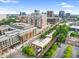 This aerial view highlights the building with surrounding businesses, parking, and a tree-lined street at 510 Glenwood Ave # 510, Raleigh, NC 27603