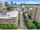 This view presents the building's architecture along a tree-lined street near urban surroundings at 510 Glenwood Ave # 510, Raleigh, NC 27603