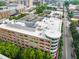 This bird's eye view captures the building's rooftop, surrounded by green trees and a well-connected street at 510 Glenwood Ave # 510, Raleigh, NC 27603