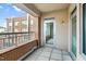 A spacious balcony with brick and metal railings leads to a glass doorway at 510 Glenwood Ave # 510, Raleigh, NC 27603