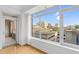 Bright room with a balcony offering city views from large windows and hardwood floors at 510 Glenwood Ave # 510, Raleigh, NC 27603