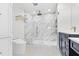 Luxurious bathroom featuring marble shower, custom vanity, and modern toilet at 510 Glenwood Ave # 510, Raleigh, NC 27603
