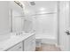 Bright bathroom features a vanity with a single sink, toilet, and shower-tub combination at 510 Glenwood Ave # 510, Raleigh, NC 27603