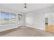 Bright bedroom featuring carpet floors, ceiling fan, and window views at 510 Glenwood Ave # 510, Raleigh, NC 27603