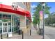 Street view of a building with a covered walkway and decorative lighting on the side of the road at 510 Glenwood Ave # 510, Raleigh, NC 27603