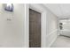 Hallway showing apartment 510, leading to a table with a floral arrangement at the end at 510 Glenwood Ave # 510, Raleigh, NC 27603