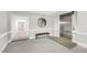 Hallway with an elevator, carpet, bench, mirror and white walls, and molding details at 510 Glenwood Ave # 510, Raleigh, NC 27603