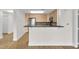 Kitchen showcasing a bar and stainless steel appliances at 510 Glenwood Ave # 510, Raleigh, NC 27603