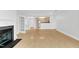Open living area showcasing wood floors, fireplace, and kitchen view at 510 Glenwood Ave # 510, Raleigh, NC 27603