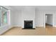 Living room featuring a fireplace, large window, and wood floors at 510 Glenwood Ave # 510, Raleigh, NC 27603