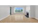Living room shows a fireplace, balcony access, large windows and hardwood floors at 510 Glenwood Ave # 510, Raleigh, NC 27603