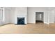 Living room with a fireplace and an open door to another room at 510 Glenwood Ave # 510, Raleigh, NC 27603