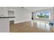 Living room showing large windows with city views, hardwood floors, and granite countertop at 510 Glenwood Ave # 510, Raleigh, NC 27603