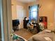 Modest bedroom with a window, a door, and a bed, offering a private space for rest and relaxation at 5404 Drum Inlet Pl, Raleigh, NC 27610