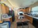 Functional kitchen featuring wooden cabinets, tile flooring, and ample counter space for cooking and meal preparation at 5404 Drum Inlet Pl, Raleigh, NC 27610