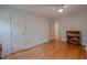 Bedroom with hardwood floors, ceiling fan, and closet at 5632 Falkirk Dr, Durham, NC 27712