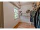 Walk-in closet with shelving, a window, and plenty of space for storage at 5632 Falkirk Dr, Durham, NC 27712