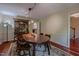 Dining room with wood furniture, decorative rug, and hardwood floors at 5632 Falkirk Dr, Durham, NC 27712
