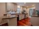Charming kitchen with stainless steel appliances, ample counter space, and warm wood floors at 5632 Falkirk Dr, Durham, NC 27712