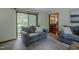 Cozy living room features plush seating and a sliding glass door at 5632 Falkirk Dr, Durham, NC 27712