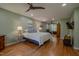 Relaxing main bedroom with hardwood floors, ample space, and ceiling fan at 5632 Falkirk Dr, Durham, NC 27712