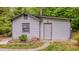 Outbuilding with a classic design, well-manicured landscaping, and a neatly paved walkway at 5632 Falkirk Dr, Durham, NC 27712