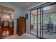 View from inside the home looking out onto a screened in porch and kitchen at 5632 Falkirk Dr, Durham, NC 27712