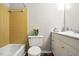Cozy bathroom featuring a shower, vanity, and stylish tile accents at 5805 Farm Gate Rd, Raleigh, NC 27606